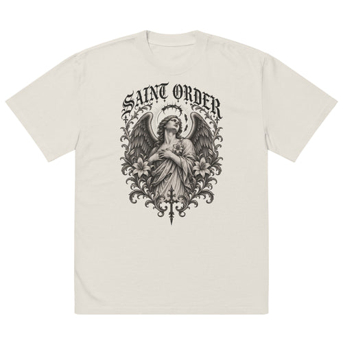 Saint Order Fallen oversized faded-bone tee, front view with winged figure, broken halo, lilies and charcoal botanical artwork.