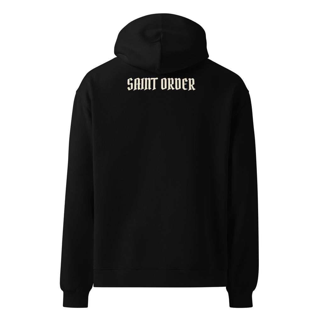 Back of the black Saint Order Eternal relaxed hoodie, with an ivory Saint Order wordmark below the hood.