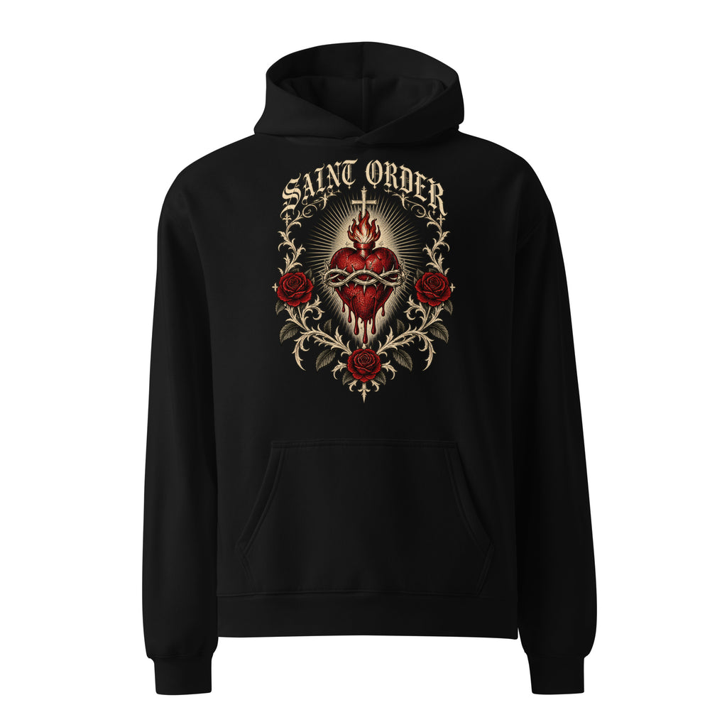 Front of the black Saint Order Eternal relaxed hoodie, with sacred-heart, rose and thorn artwork above the kangaroo pocket.