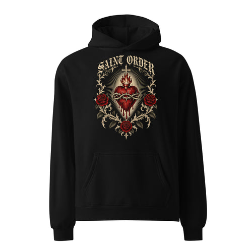 Front of the black Saint Order Eternal relaxed hoodie, with sacred-heart, rose and thorn artwork above the kangaroo pocket.